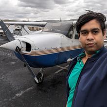 Jit Ray Chowdhury with Cessna at airfield after flying in rain