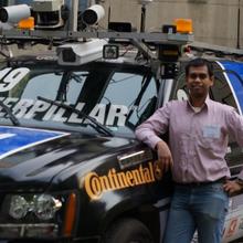 Jit Ray Chowdhury with CMU Boss autonomous vehicle DARPA Urban Challenge
